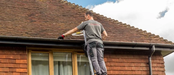 our team cleaning the gutters on a house in Warwickshire