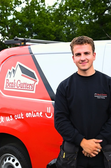 our gutter cleaner in Warwickshire standing by company vehicle
